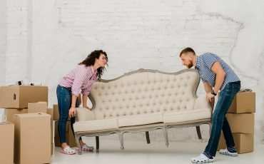 couple-moving-sofa_23-2147758716